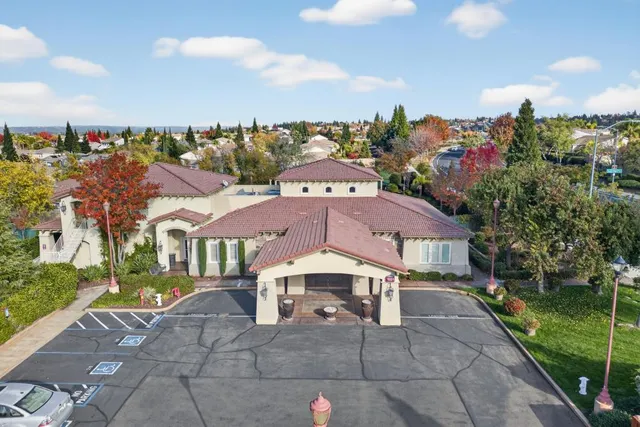 a table with wine bottles and glasses on it