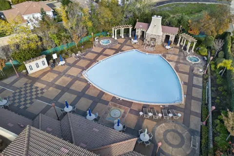 an aerial view of residential houses with outdoor space