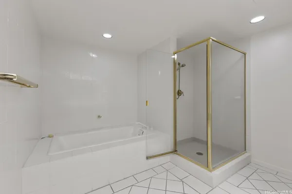 a bathroom with a shower and a bath tub