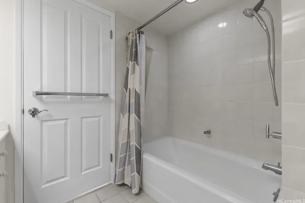 a bathroom with a bathtub a toilet and a shower