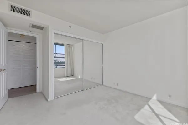 an empty room with shelves