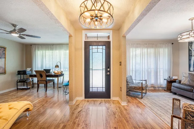 a view of a livingroom with furniture window and wooden floor