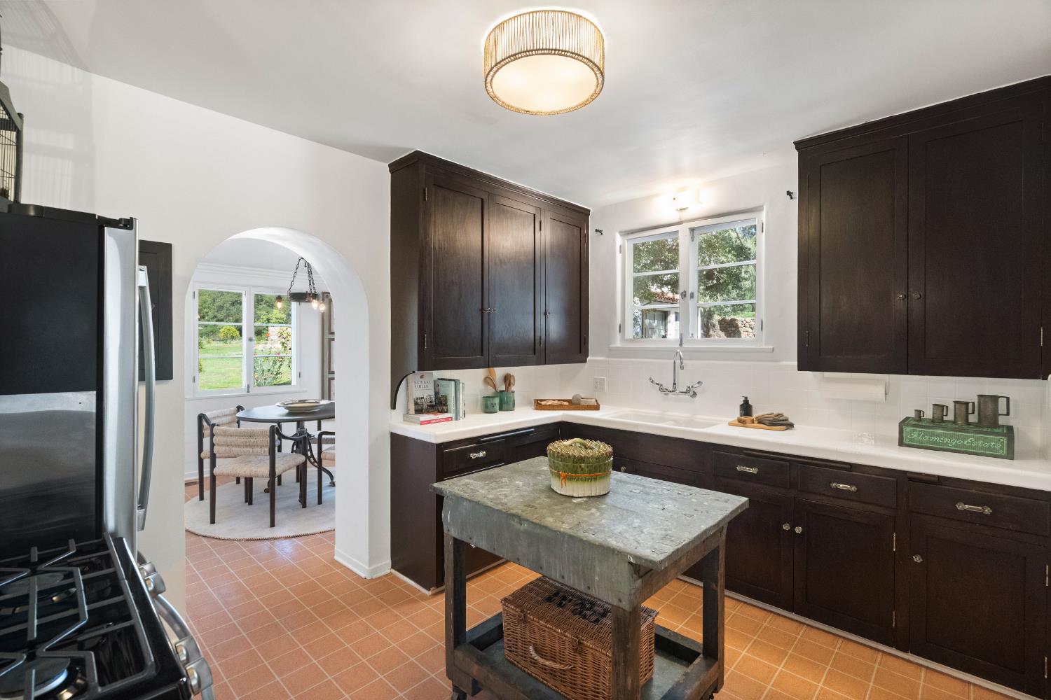 3935 Thacher Road Ojai, CA 93023 - Photo 16 of 50 a kitchen with sink refrigerator dining table and chairs