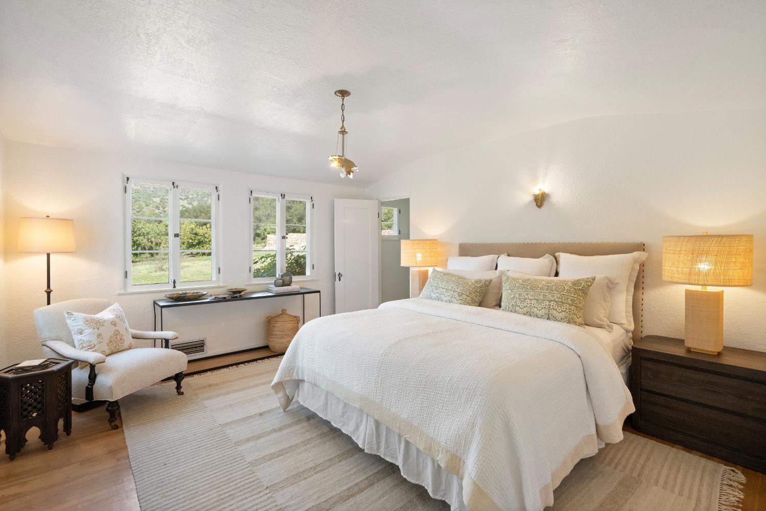 3935 Thacher Road Ojai, CA 93023 - Photo 31 of 50 a spacious bedroom with a bed and wooden floor