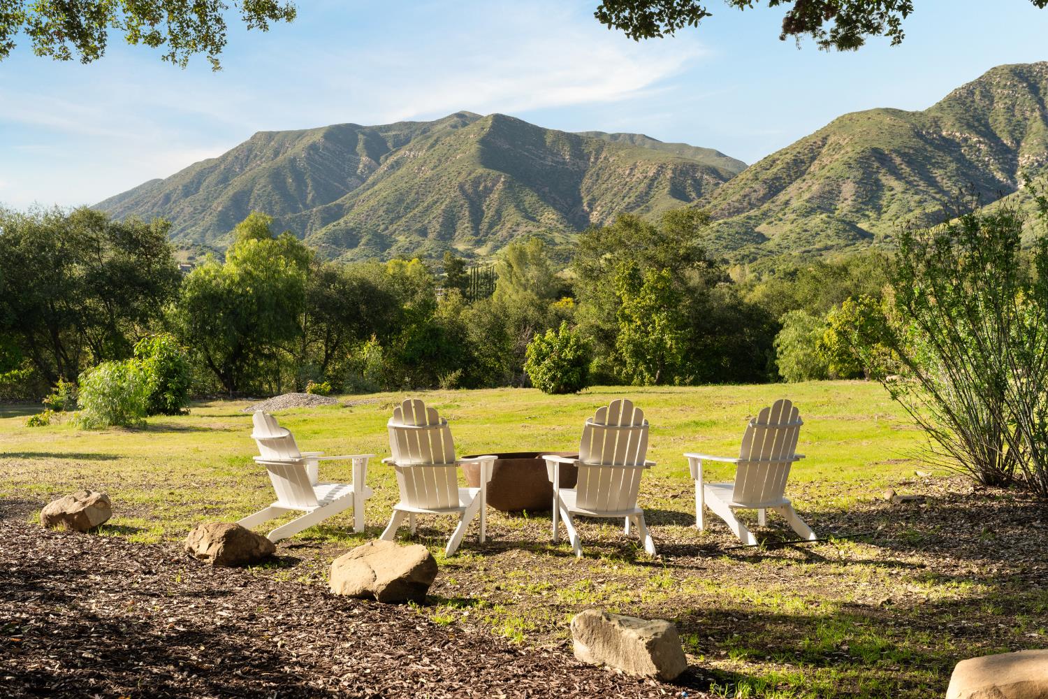 3935 Thacher Road Ojai, CA 93023 - Photo 4 of 50 a view of a swimming pool with lawn chairs under an umbrella