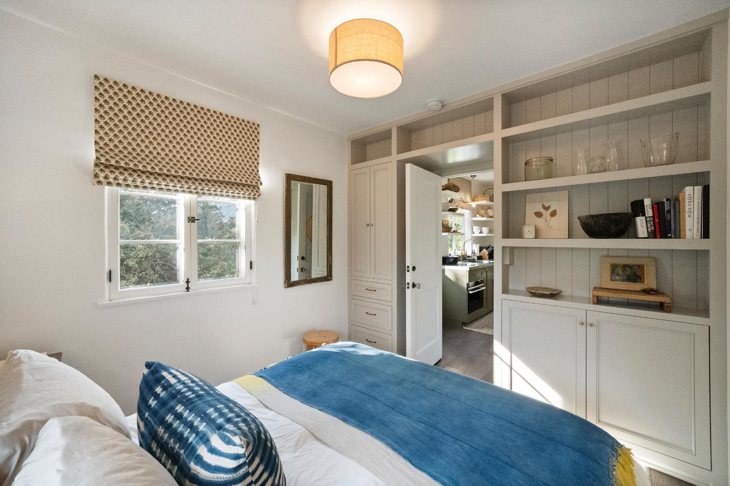 3935 Thacher Road Ojai, CA 93023 - Photo 42 of 50 a bedroom with a bed and a chandelier