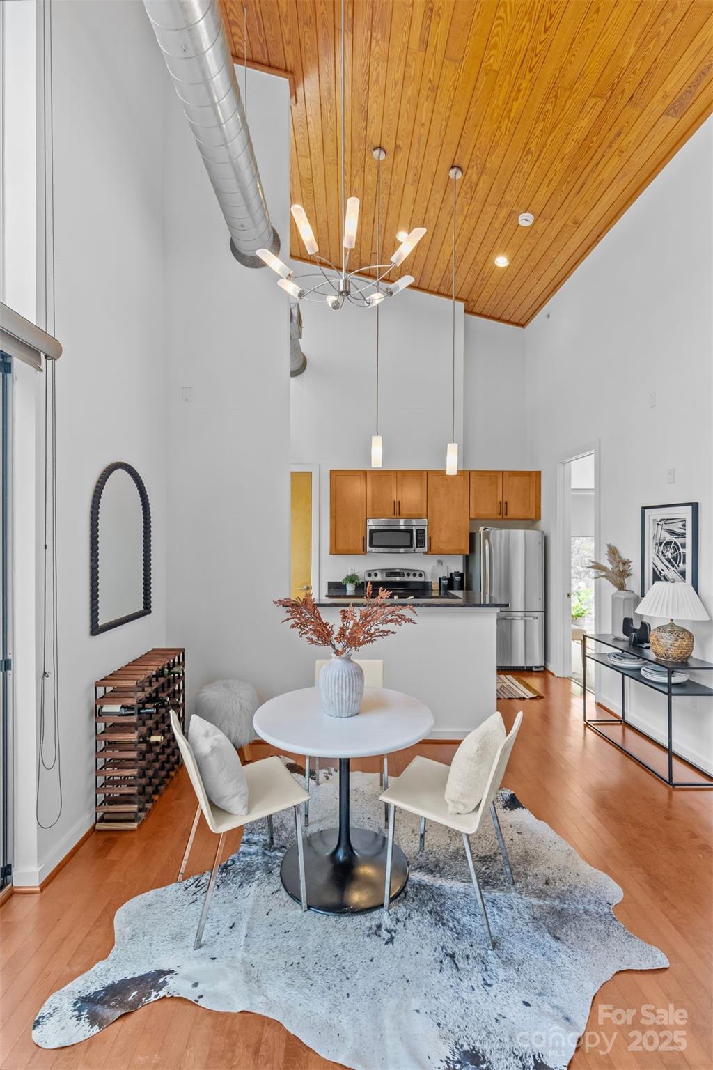 2116 McClintock Road, Unit 232 Charlotte, NC 28205 - Photo 15 of 48 a living room with furniture a rug and a table