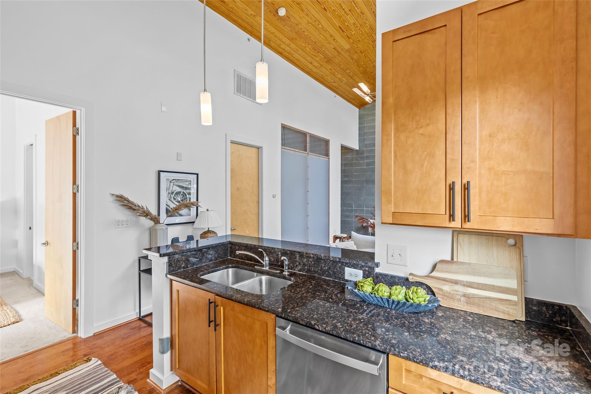 2116 McClintock Road, Unit 232 Charlotte, NC 28205 - Photo 21 of 48 a kitchen with stainless steel appliances granite countertop a sink a stove and a refrigerator