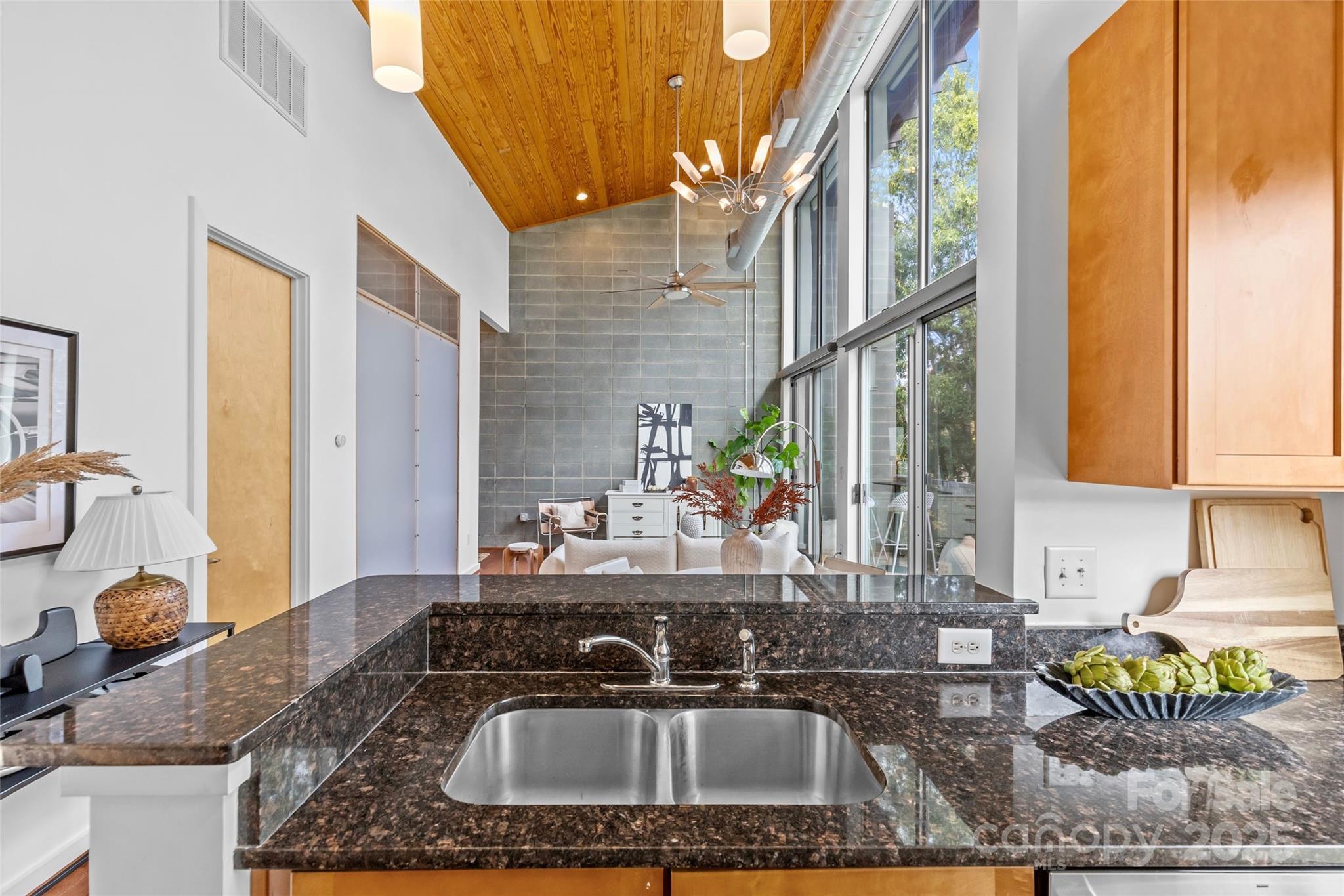 2116 McClintock Road, Unit 232 Charlotte, NC 28205 - Photo 24 of 48 a kitchen with a sink and a granite counter tops