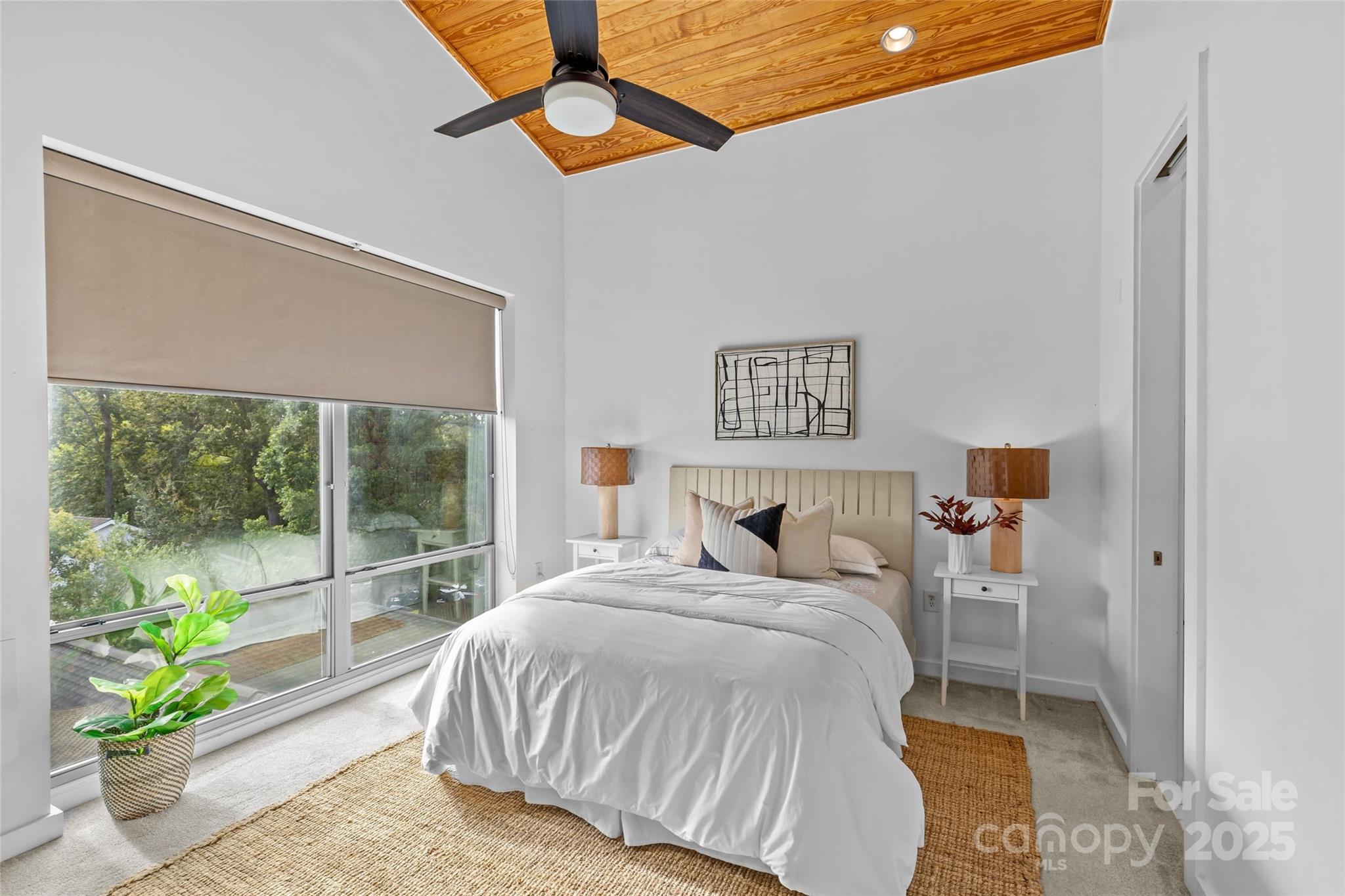 2116 McClintock Road, Unit 232 Charlotte, NC 28205 - Photo 29 of 48 a bedroom with a bed and a window