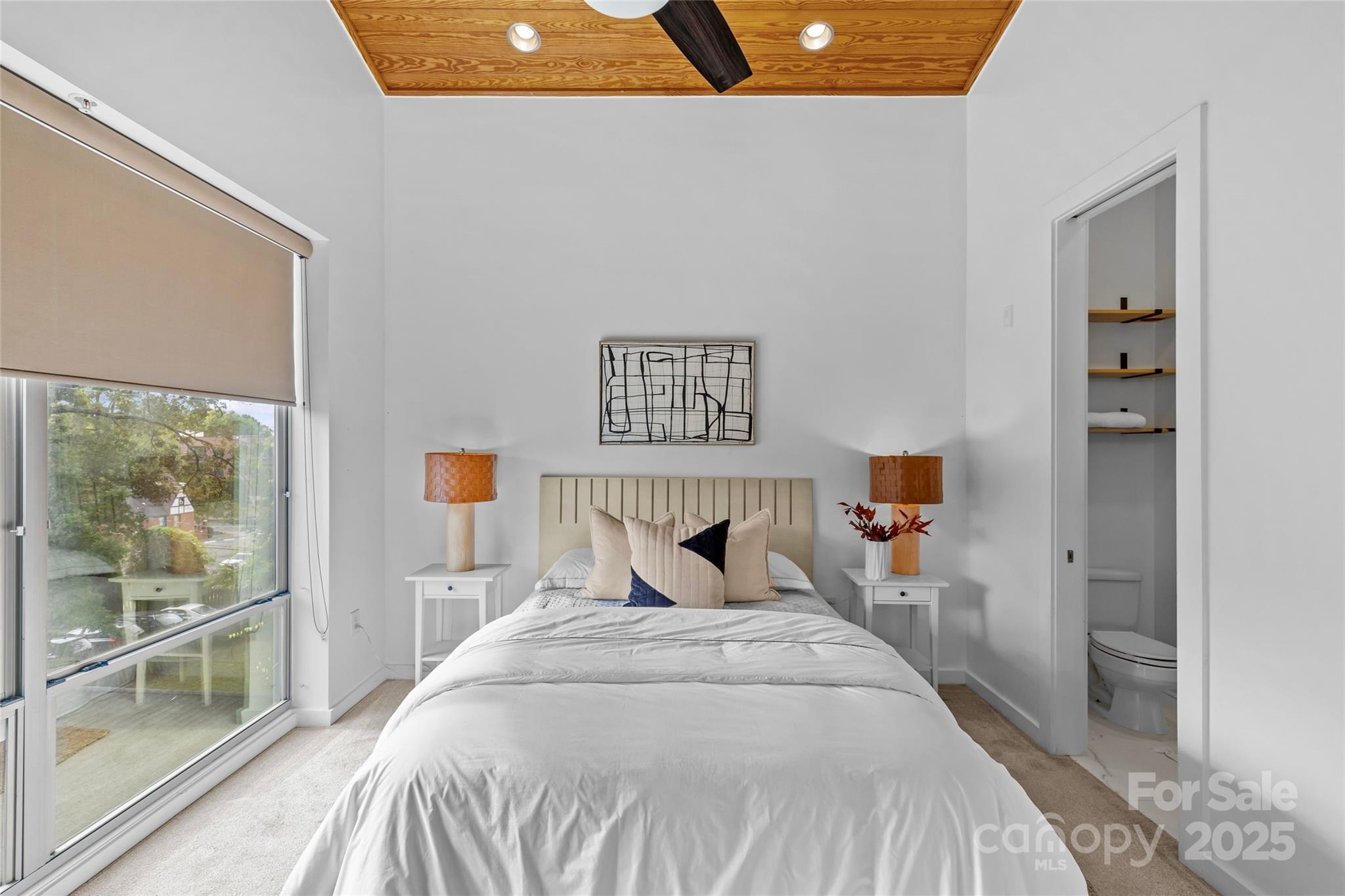 2116 McClintock Road, Unit 232 Charlotte, NC 28205 - Photo 30 of 48 a bedroom with a bed and a large window