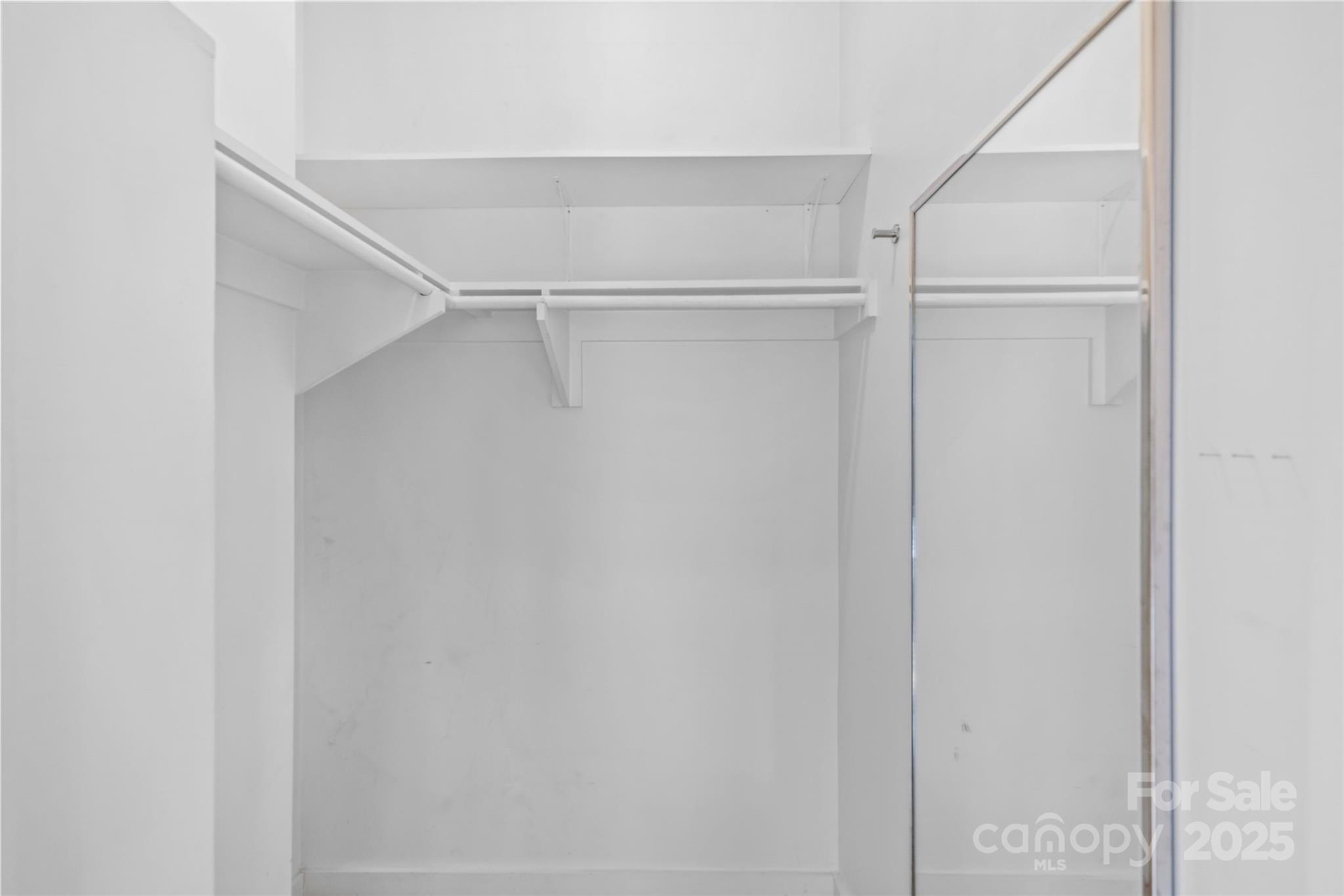 2116 McClintock Road, Unit 232 Charlotte, NC 28205 - Photo 33 of 48 a view of an empty walk in closet