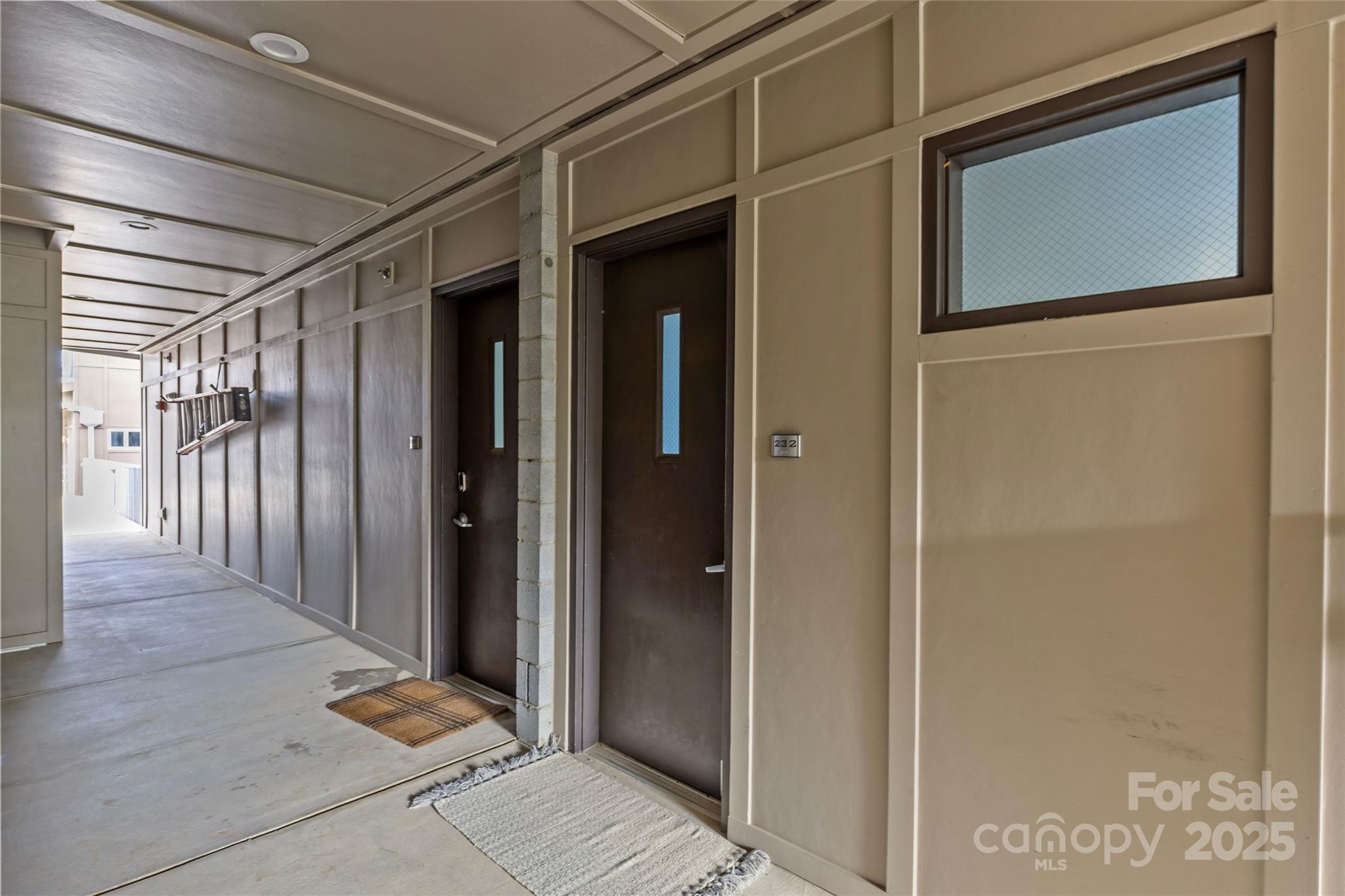 2116 McClintock Road, Unit 232 Charlotte, NC 28205 - Photo 40 of 48 a view of a hallway with wooden floor