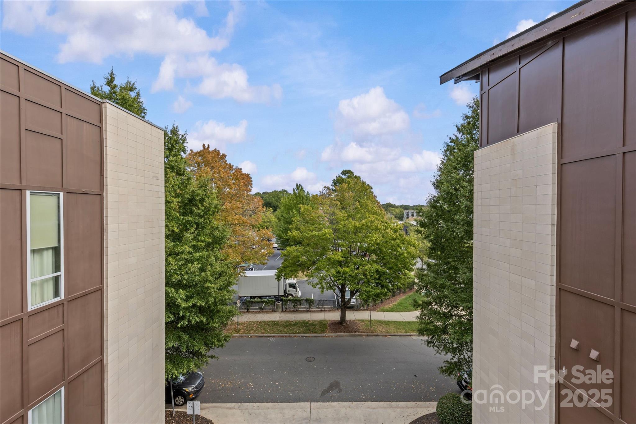 2116 McClintock Road, Unit 232 Charlotte, NC 28205 - Photo 43 of 48 a view of a street with a building in front of it