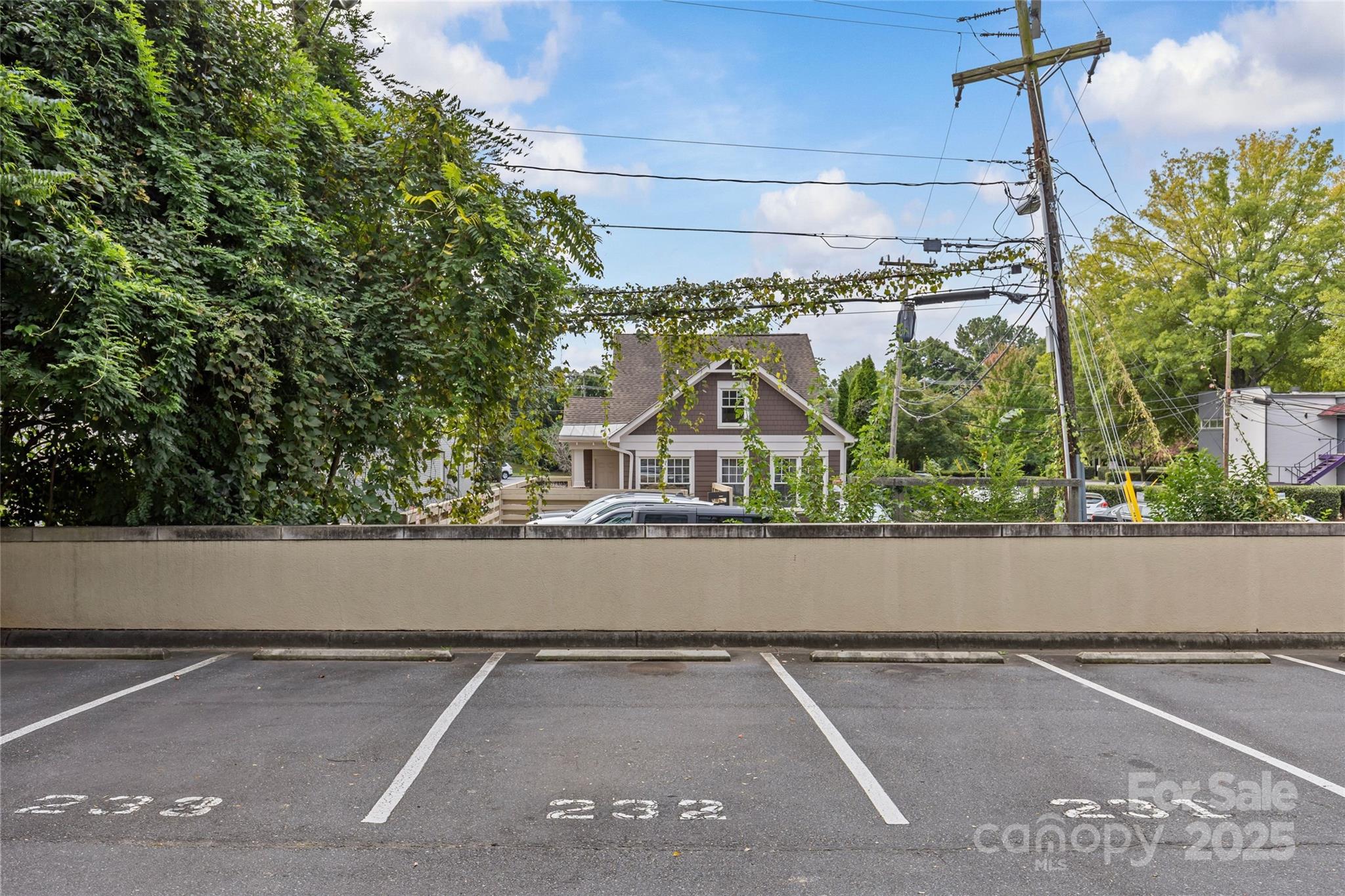 2116 McClintock Road, Unit 232 Charlotte, NC 28205 - Photo 44 of 48 a view of a street with a car park side of road