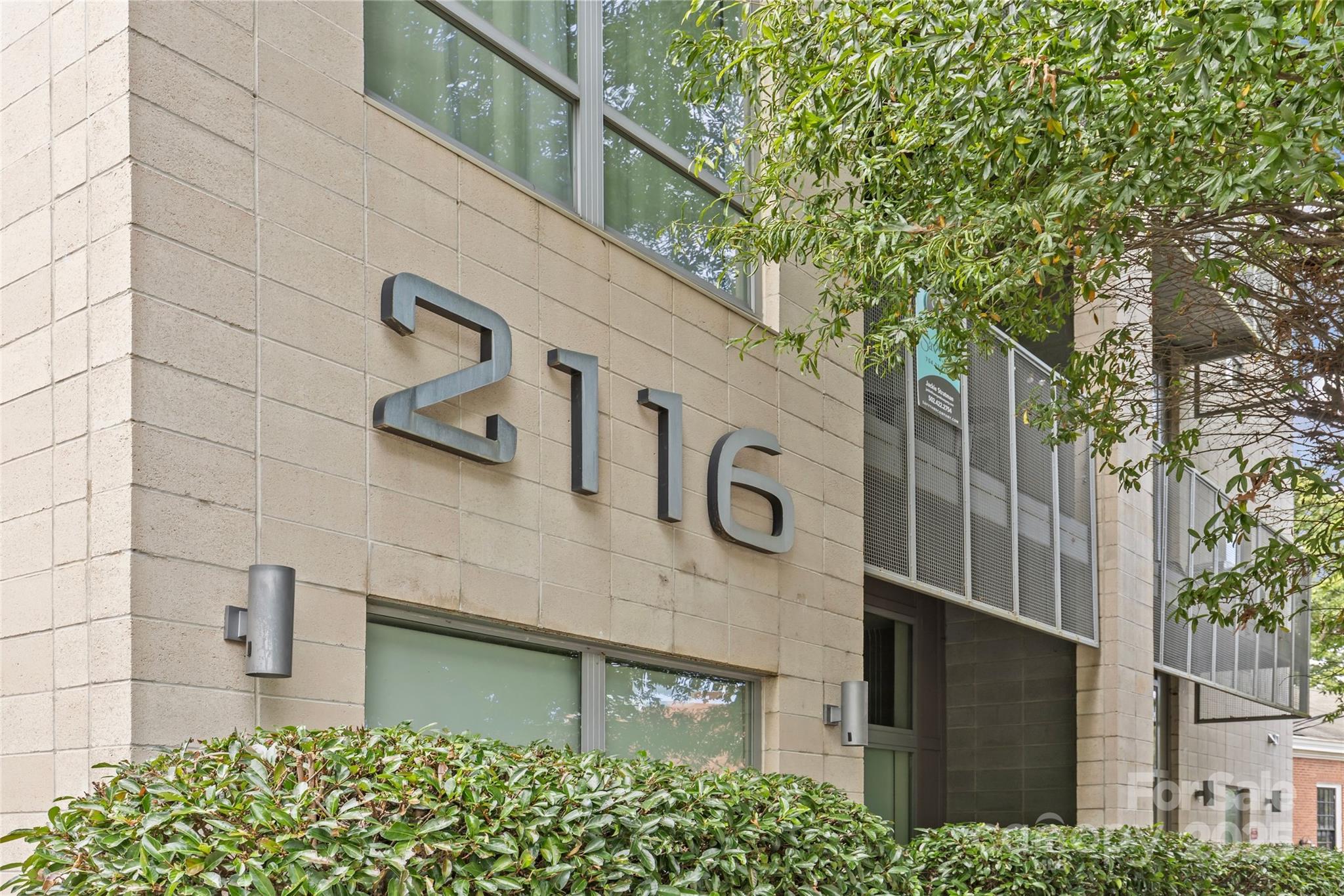 2116 McClintock Road, Unit 232 Charlotte, NC 28205 - Photo 48 of 48 a front view of a building with garden