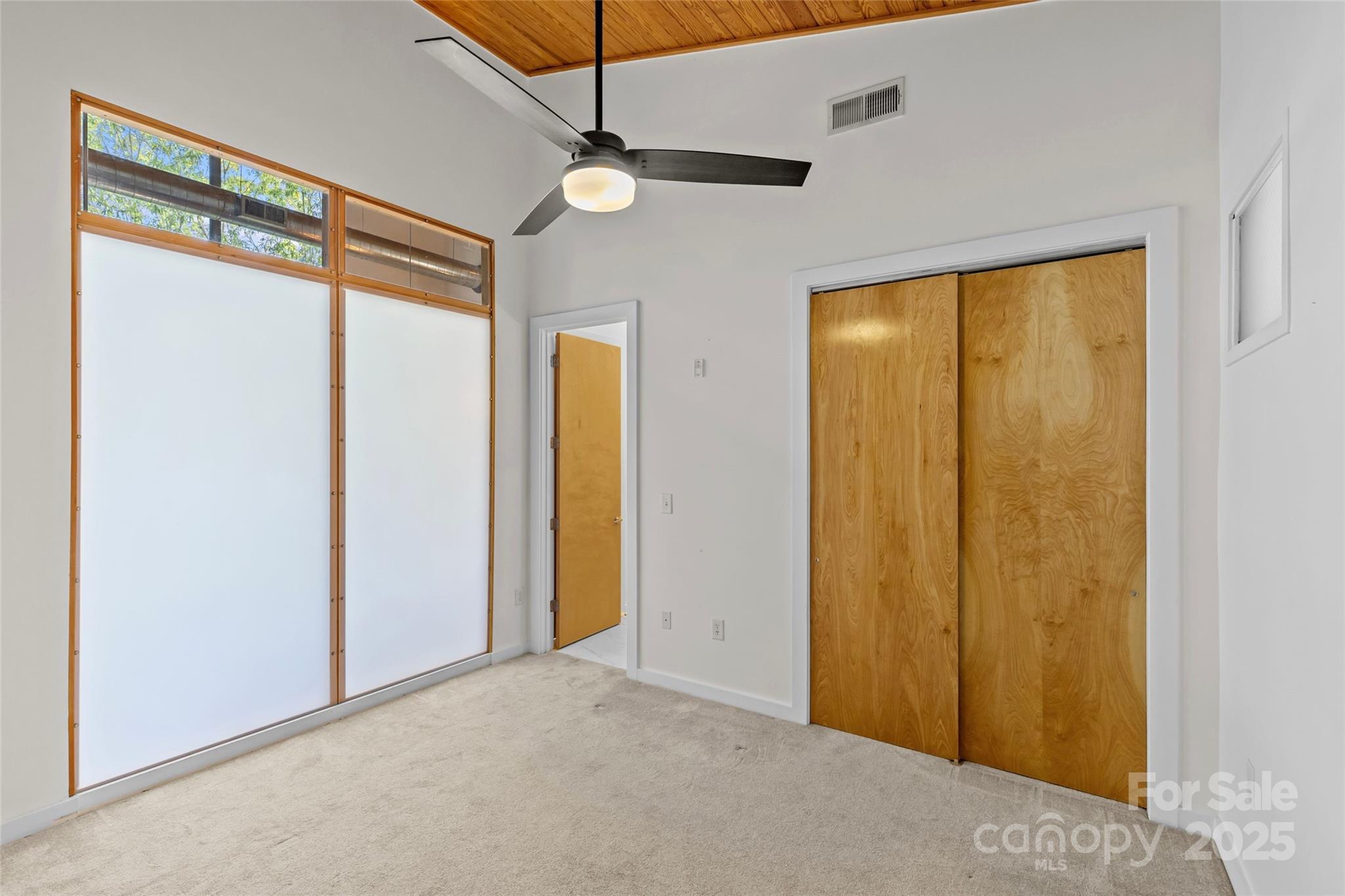 2116 McClintock Road, Unit 232 Charlotte, NC 28205 - Photo 5 of 48 a view of a room with a large window