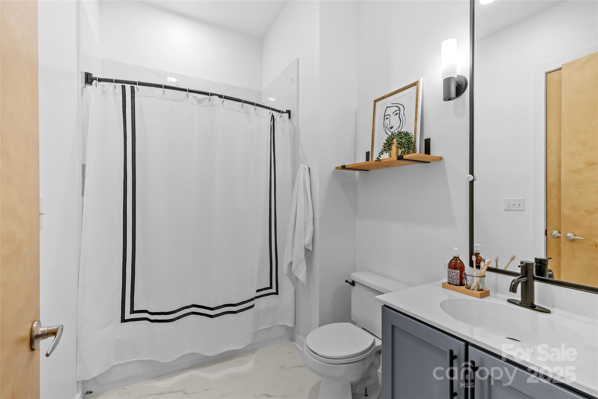 2116 McClintock Road, Unit 232 Charlotte, NC 28205 - Photo 8 of 48 a bathroom with a granite countertop sink toilet and shower