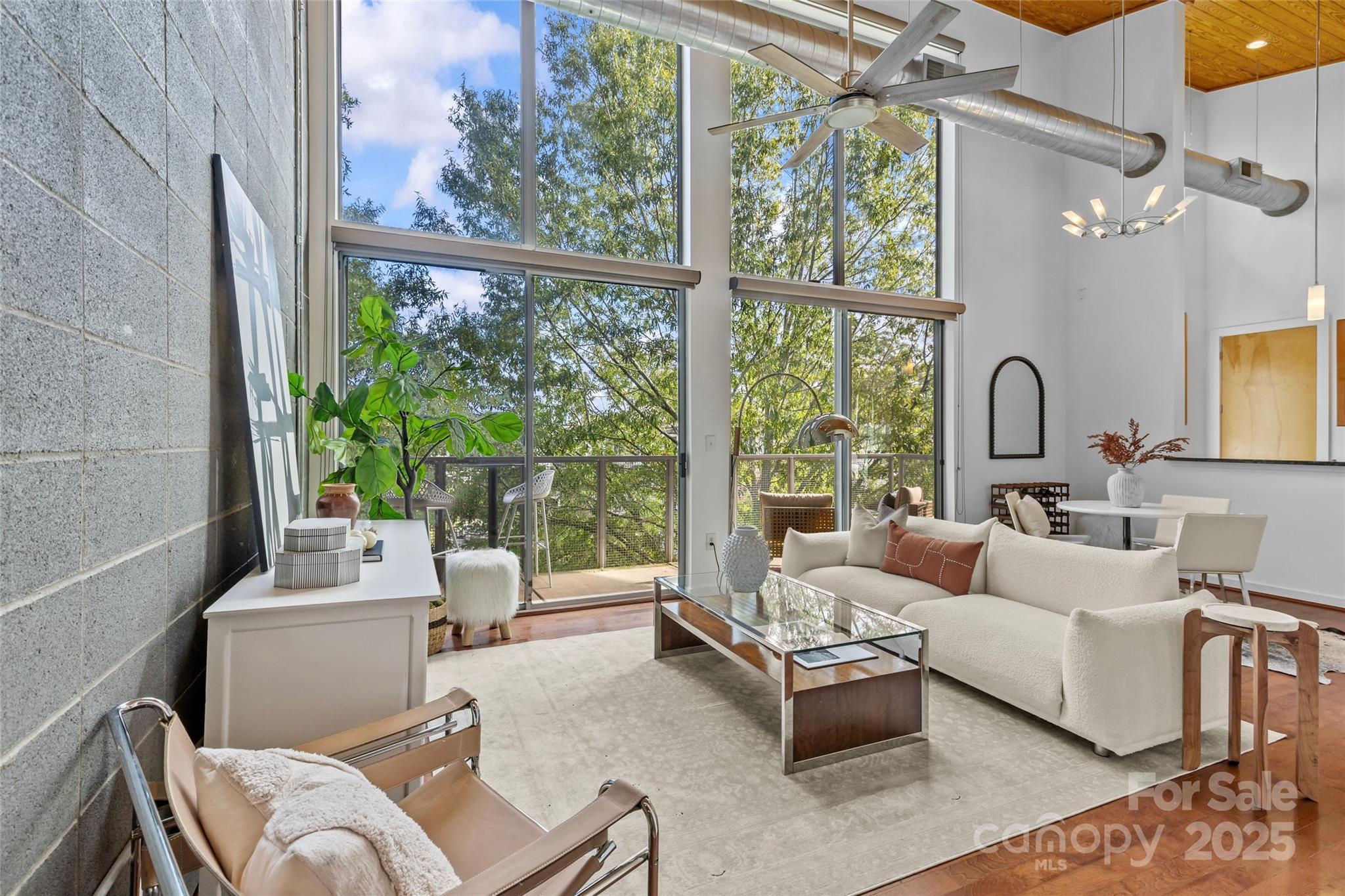 2116 McClintock Road, Unit 232 Charlotte, NC 28205 - Photo 9 of 48 a living room with furniture and a large window