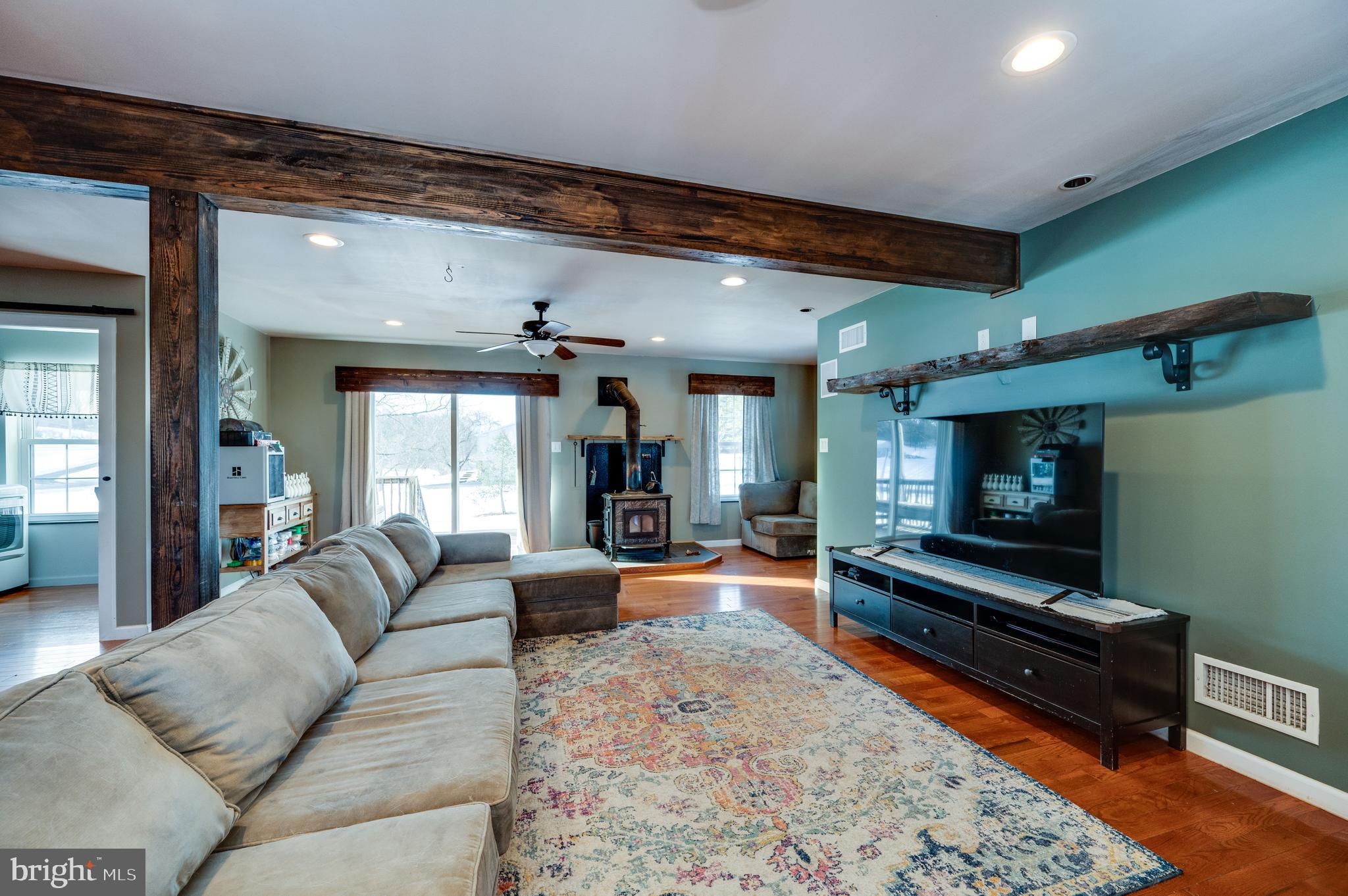 1109 Upper Van Reed Road Leesport, PA 19533 - Photo 11 of 72 a living room with furniture and a flat screen tv