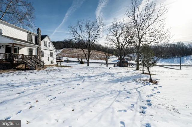 a view of a livingroom with furniture and an empty room
