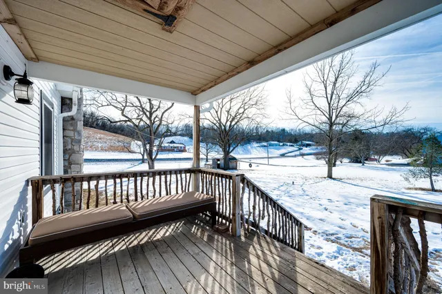 a view of a room with wooden floor and gym equipment