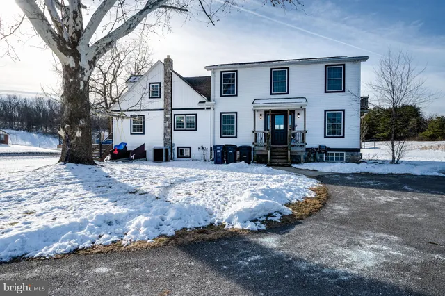 a living room with furniture fireplace and flat screen tv
