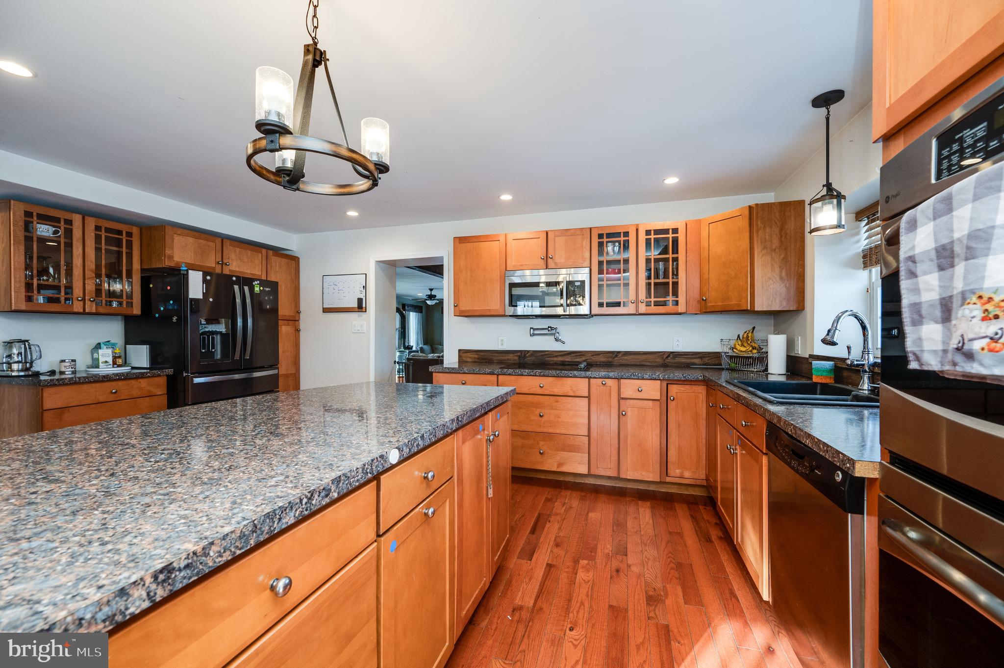 1109 Upper Van Reed Road Leesport, PA 19533 - Photo 33 of 72 a kitchen with stainless steel appliances granite countertop a sink and stove