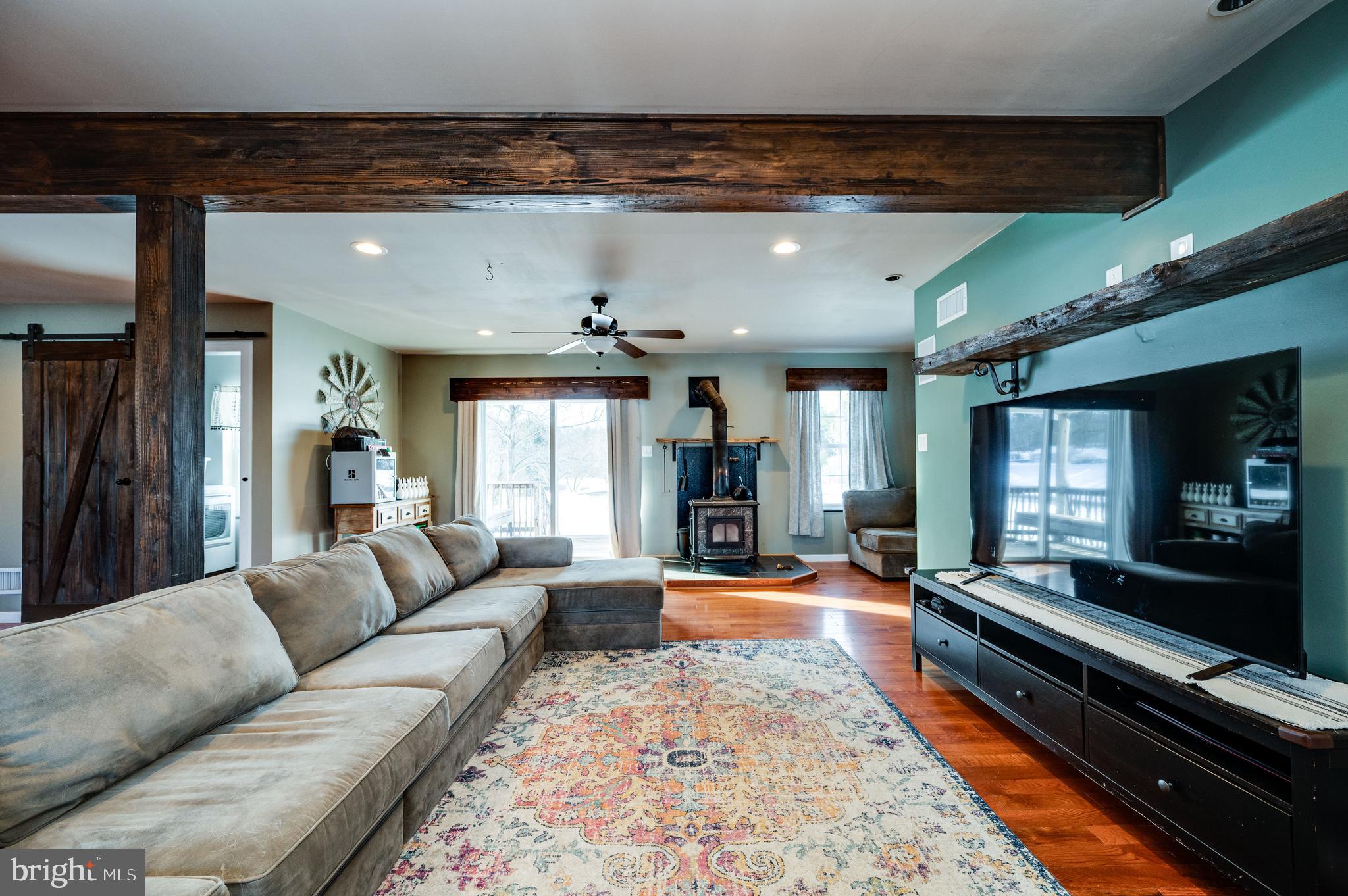 1109 Upper Van Reed Road Leesport, PA 19533 - Photo 6 of 72 a living room with furniture fireplace and flat screen tv