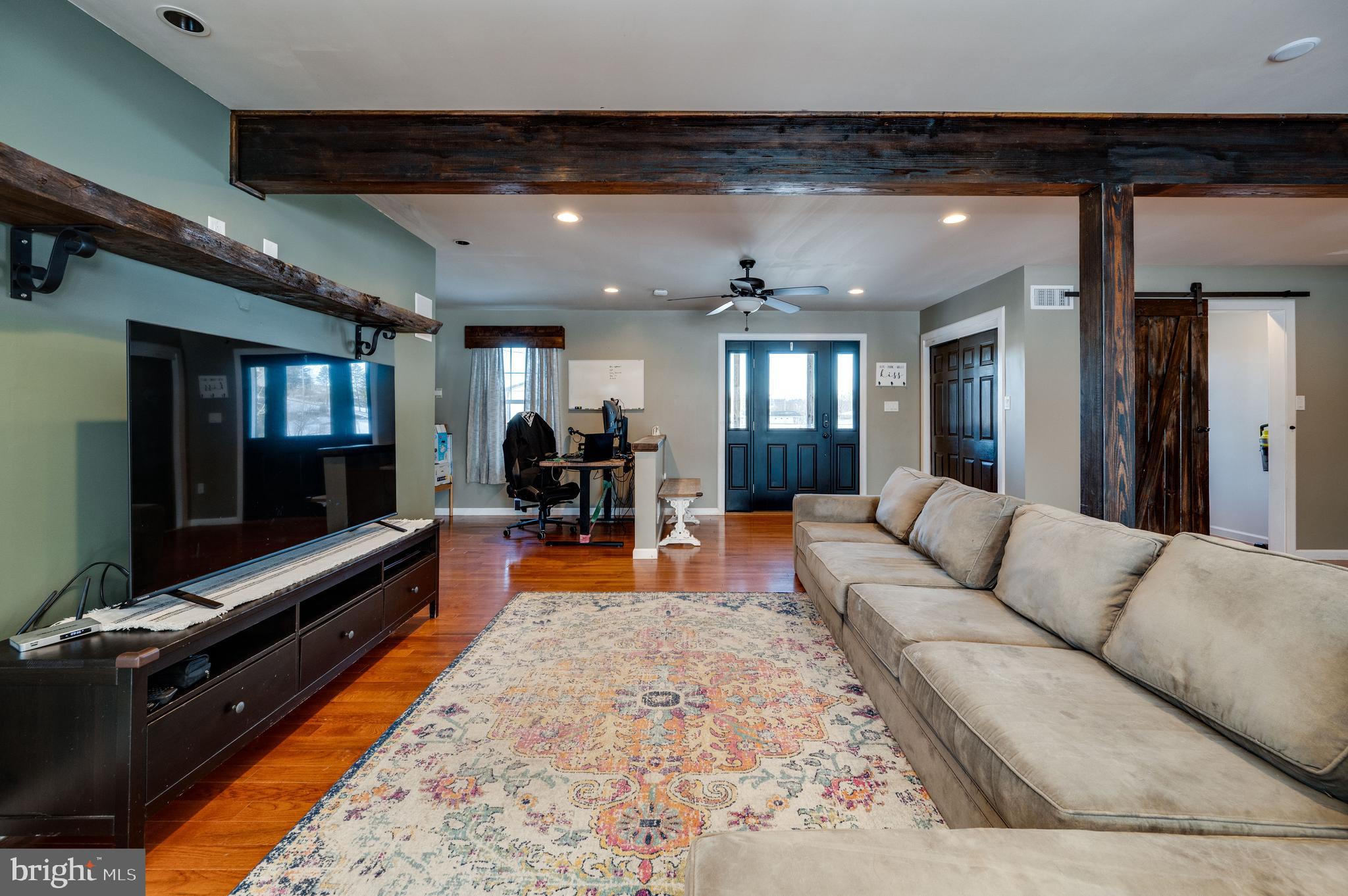 1109 Upper Van Reed Road Leesport, PA 19533 - Photo 9 of 72 a living room with furniture and a flat screen tv
