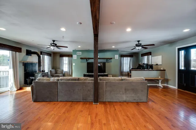 a view of balcony with wooden floor and outdoor seating