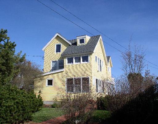 1453 Fairfield Beach Road Fairfield, CT 06824 - Photo 1 of 1 a front view of a house with a yard