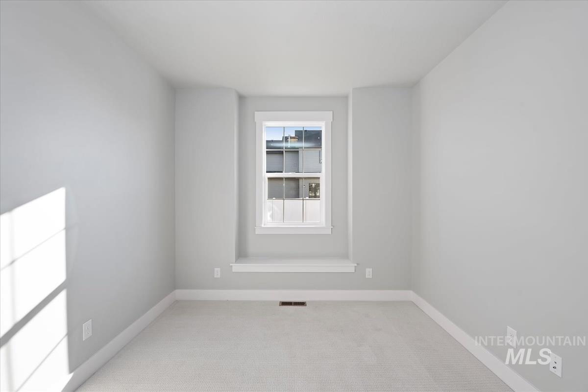 404 Hidden Mill Middleton, ID 83644 - Photo 19 of 41 Empty room with light colored carpet and baseboards