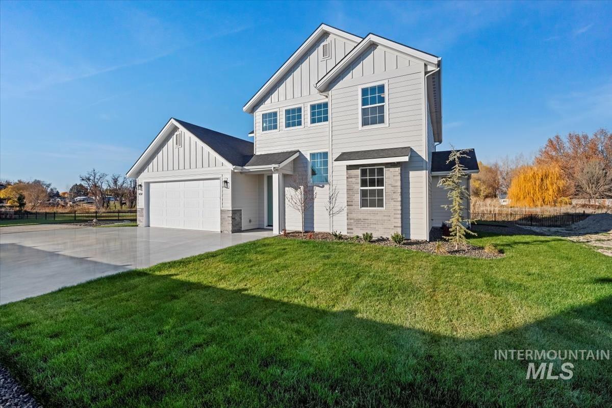 404 Hidden Mill Middleton, ID 83644 - Photo 2 of 41 Modern inspired farmhouse with board and batten siding, concrete driveway, and an attached garage