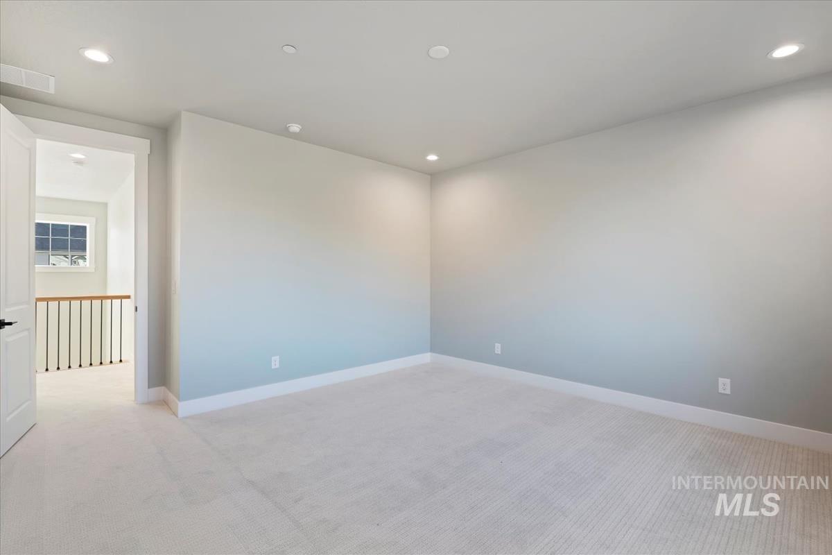 404 Hidden Mill Middleton, ID 83644 - Photo 20 of 41 Unfurnished room featuring light colored carpet and recessed lighting