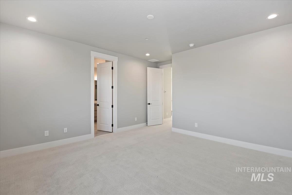404 Hidden Mill Middleton, ID 83644 - Photo 21 of 41 Unfurnished bedroom with recessed lighting and light carpet