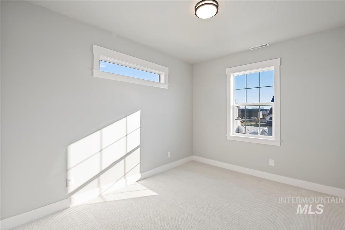 404 Hidden Mill Middleton, ID 83644 - Photo 26 of 41 Carpeted empty room with healthy amount of natural light