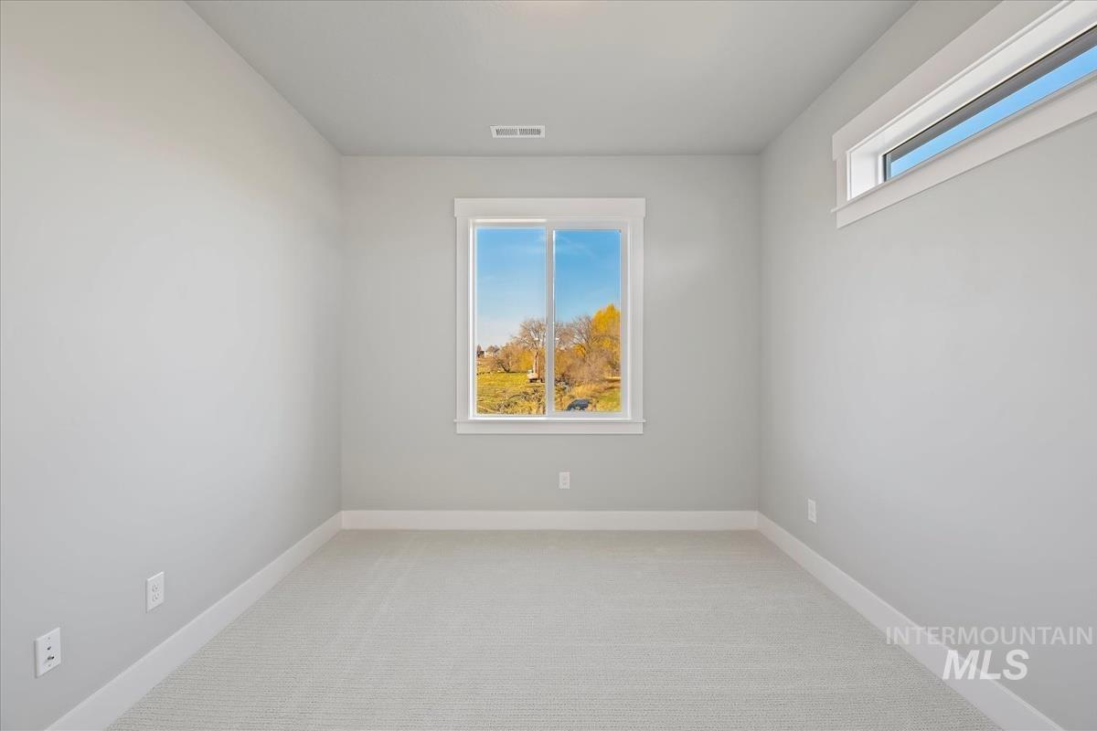 404 Hidden Mill Middleton, ID 83644 - Photo 29 of 41 Empty room featuring light colored carpet and baseboards