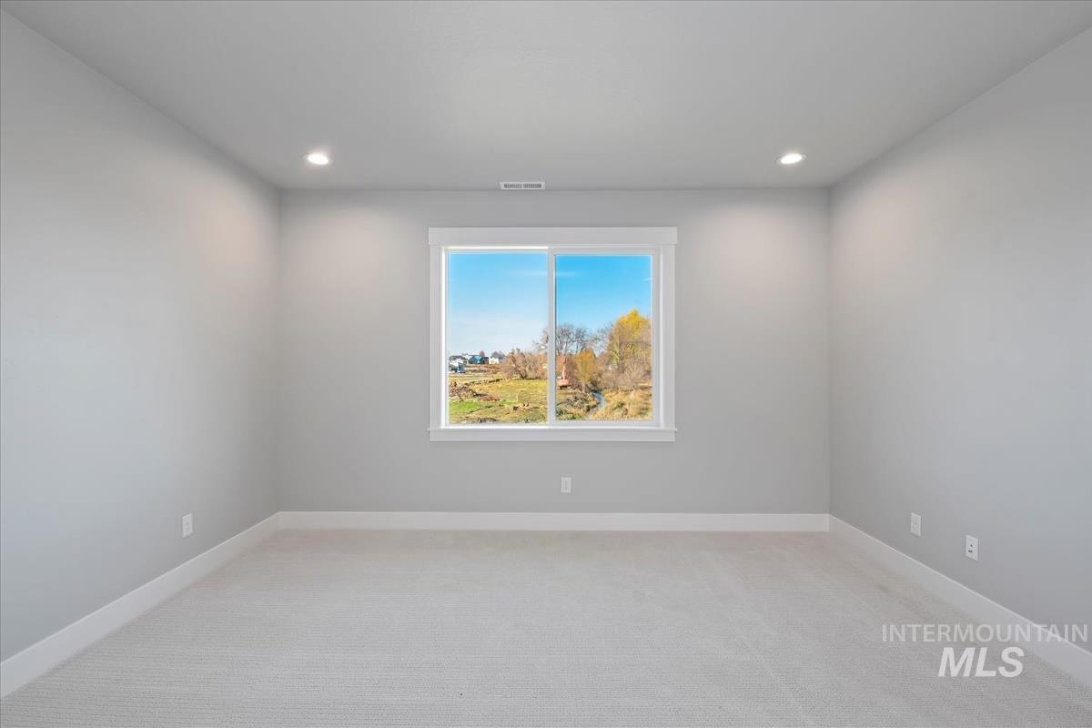 404 Hidden Mill Middleton, ID 83644 - Photo 31 of 41 Spare room featuring light carpet and recessed lighting