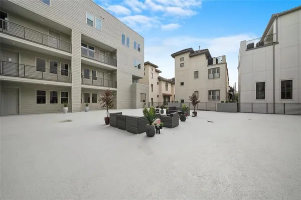 a view of a building with cars