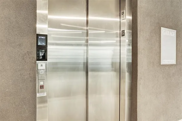 a bathroom with a glass door shower