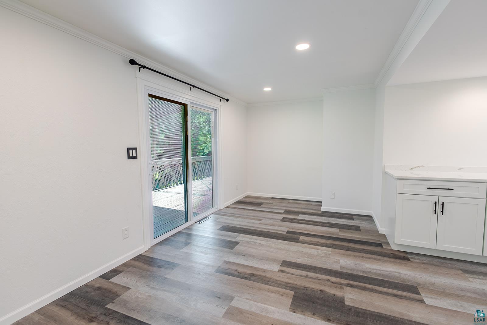 29 Ridge Road Esko, MN 55733 - Photo 16 of 41 Interior space featuring wood-finish flooring, recessed lighting, and a built-in cabinetry unit with a white countertop