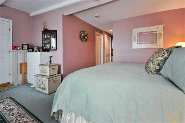 18 Olympia Road Marshfield, MA 02050 - Photo 15 of 30 a spacious bedroom with a bed and cabinets