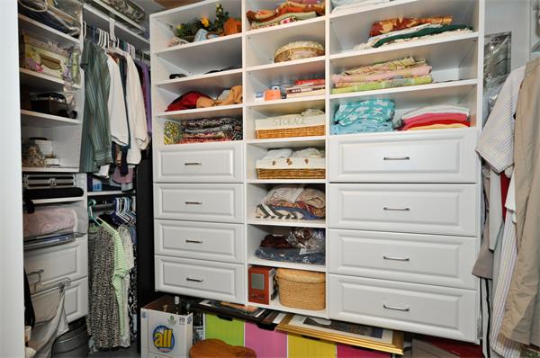 18 Olympia Road Marshfield, MA 02050 - Photo 16 of 30 a view of walk in closet with clothes and shoes