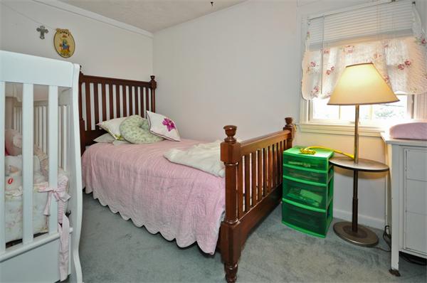 18 Olympia Road Marshfield, MA 02050 - Photo 19 of 30 a bedroom with a bed and a mirror on the dresser