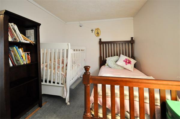 18 Olympia Road Marshfield, MA 02050 - Photo 22 of 30 a bedroom with a bed and a window