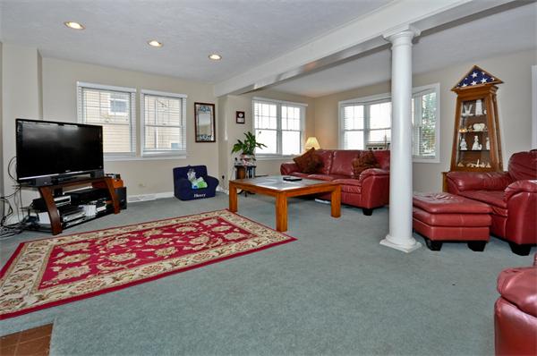 18 Olympia Road Marshfield, MA 02050 - Photo 3 of 30 a living room with furniture and a flat screen tv