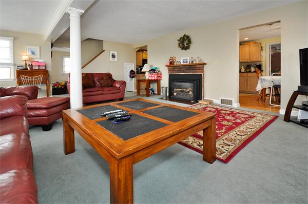 18 Olympia Road Marshfield, MA 02050 - Photo 5 of 30 a living room with furniture and a fireplace
