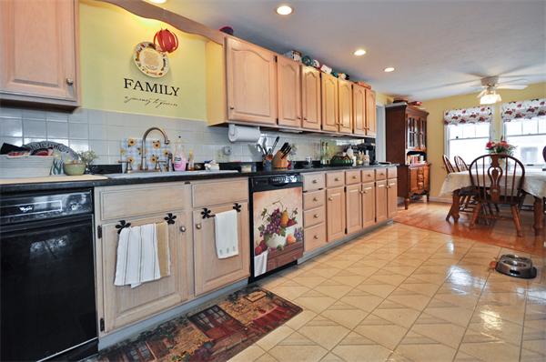 18 Olympia Road Marshfield, MA 02050 - Photo 10 of 30 a kitchen with stainless steel appliances granite countertop a refrigerator and a stove top oven