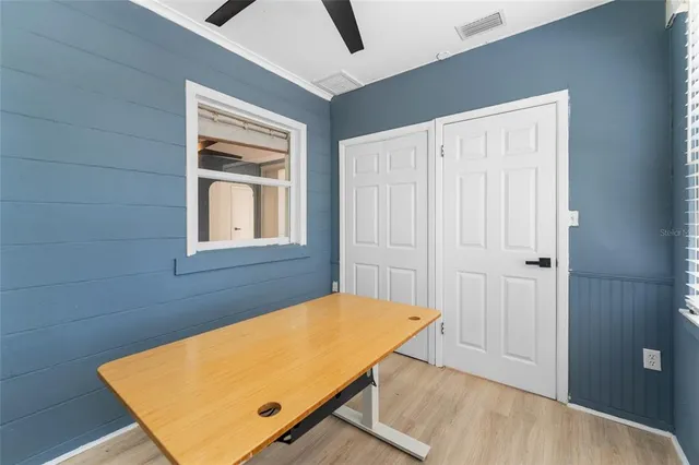 a view of a room that has a bed and a window